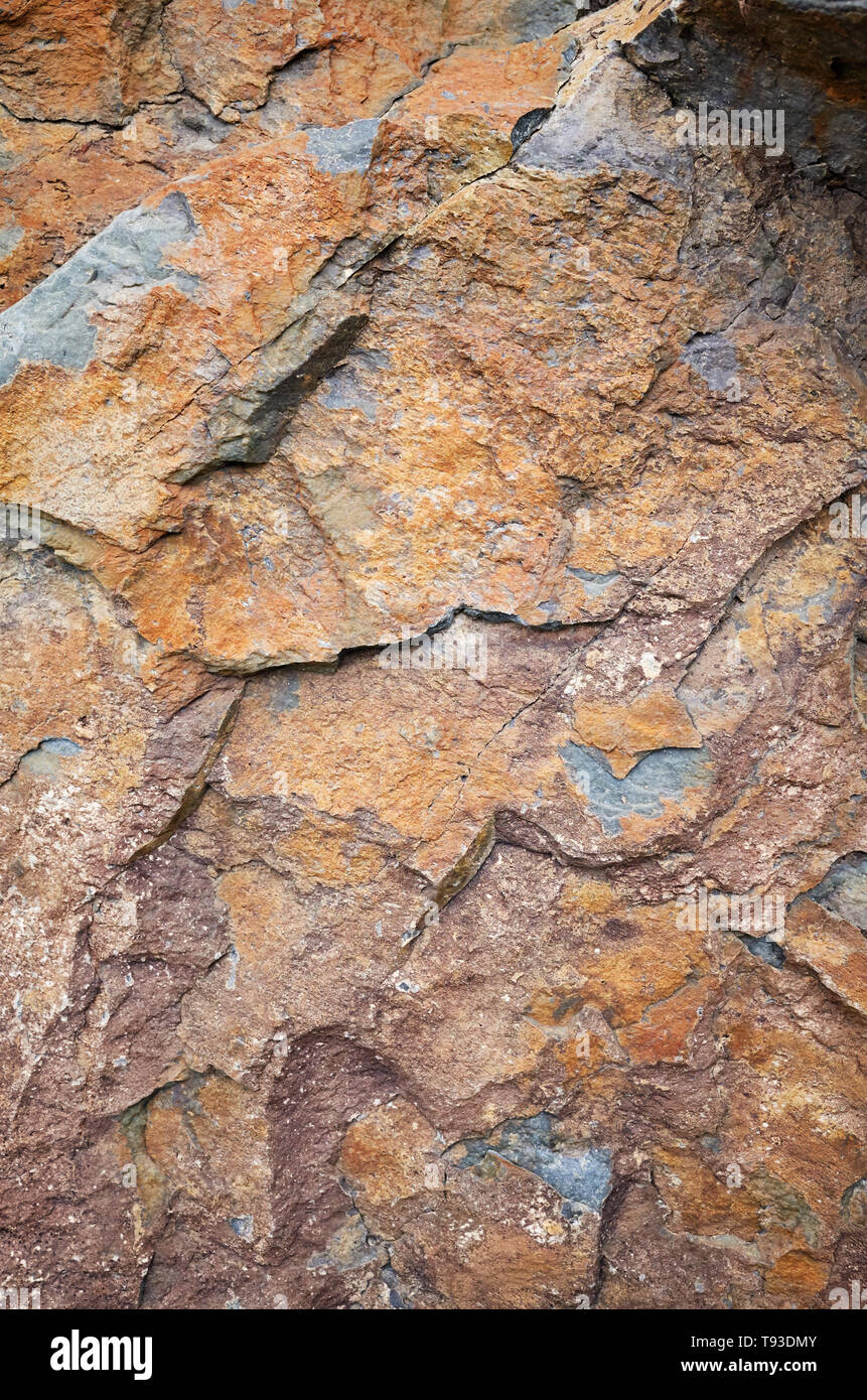 Close up picture of a rock surface, natural background or texture. Stock Photo