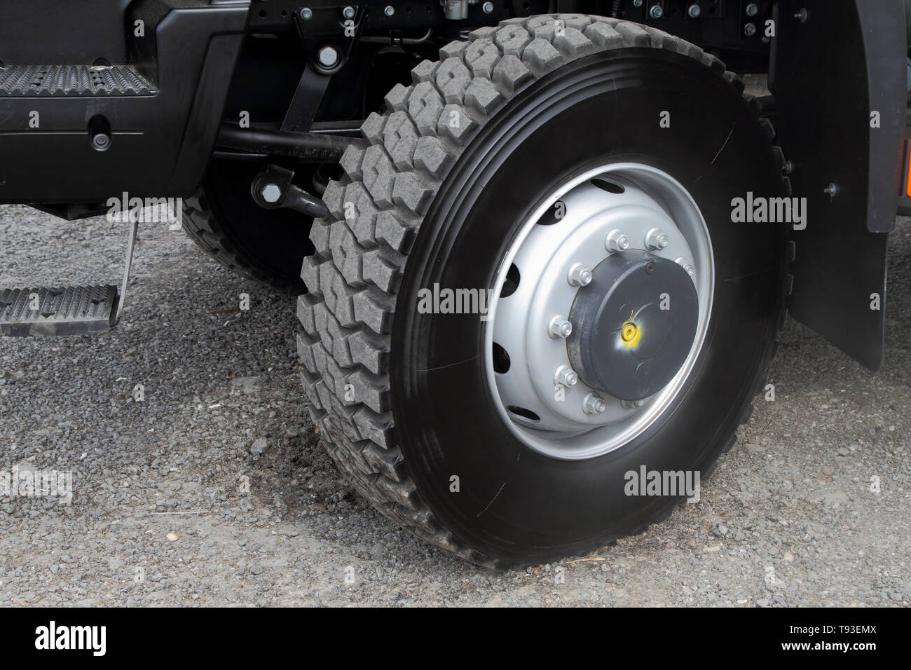 Footboard and front wheel of a modern truck. Stock Photo