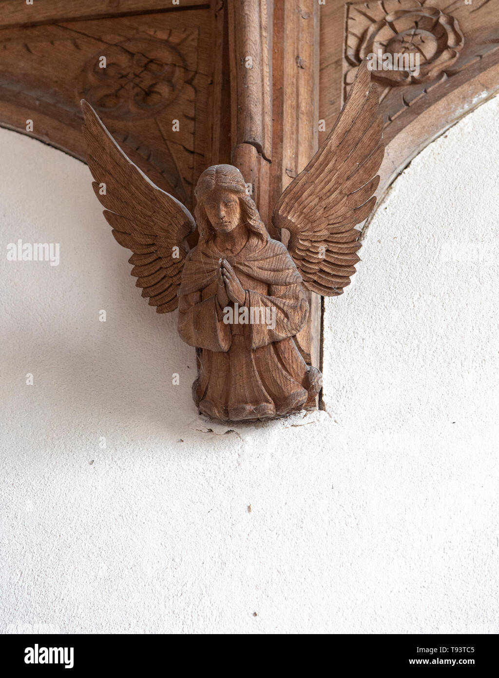 Carved wooden angel figure church of Ilketshall St Andrew, Suffolk, England, UK Stock Photo