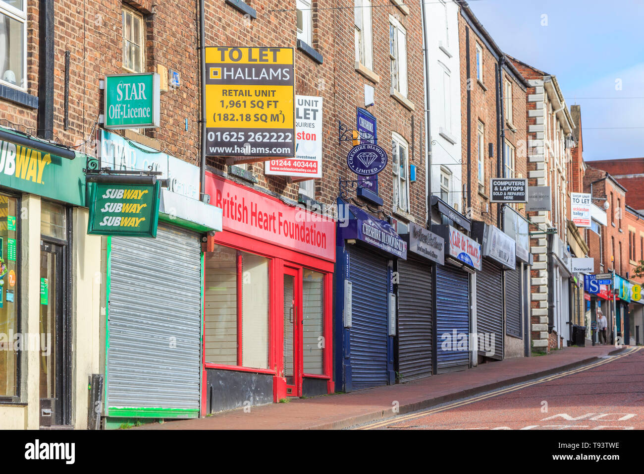 Boarded up and shutter down , closed high street shops,Macclesfield