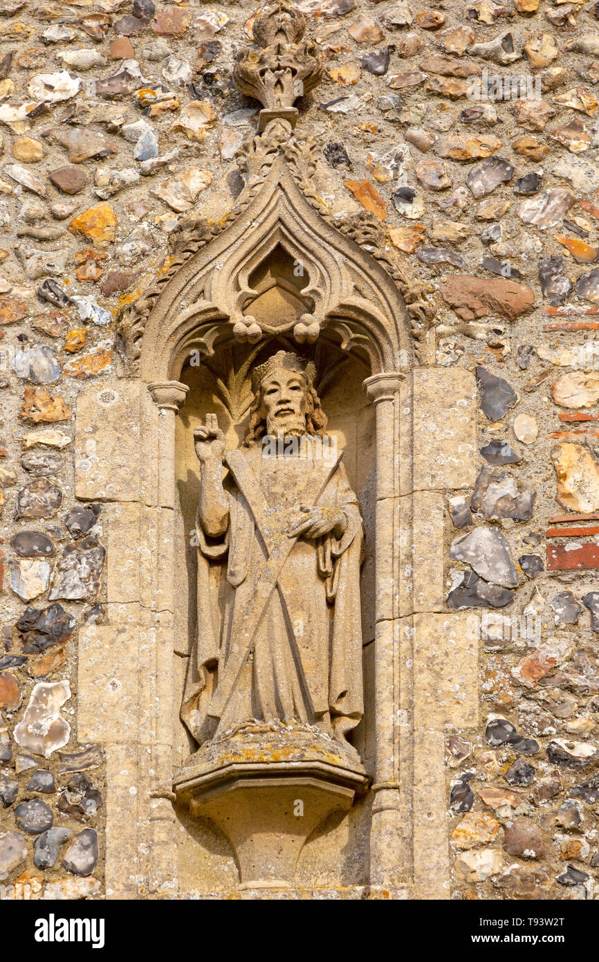 Stone statue of Saint Andrew church of Ilketshall St Andrew, Suffolk, England, UK Stock Photo