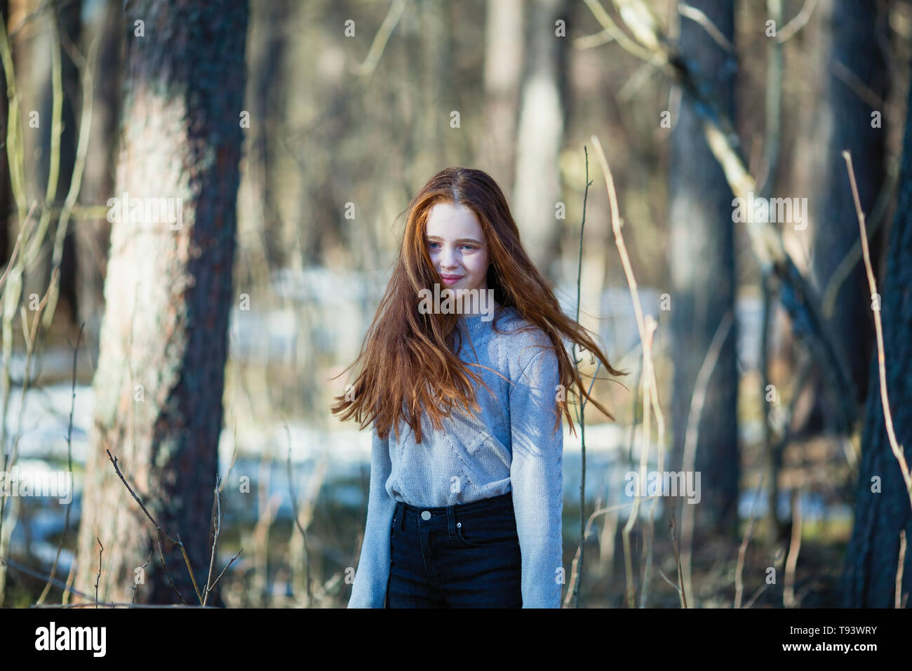 Portrait of young girl with long bright red hair, outdoors Stock Photo ...