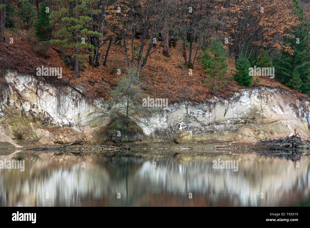 Reflections of white cliffs in autumn in Lake Britton, California, USA Stock Photo