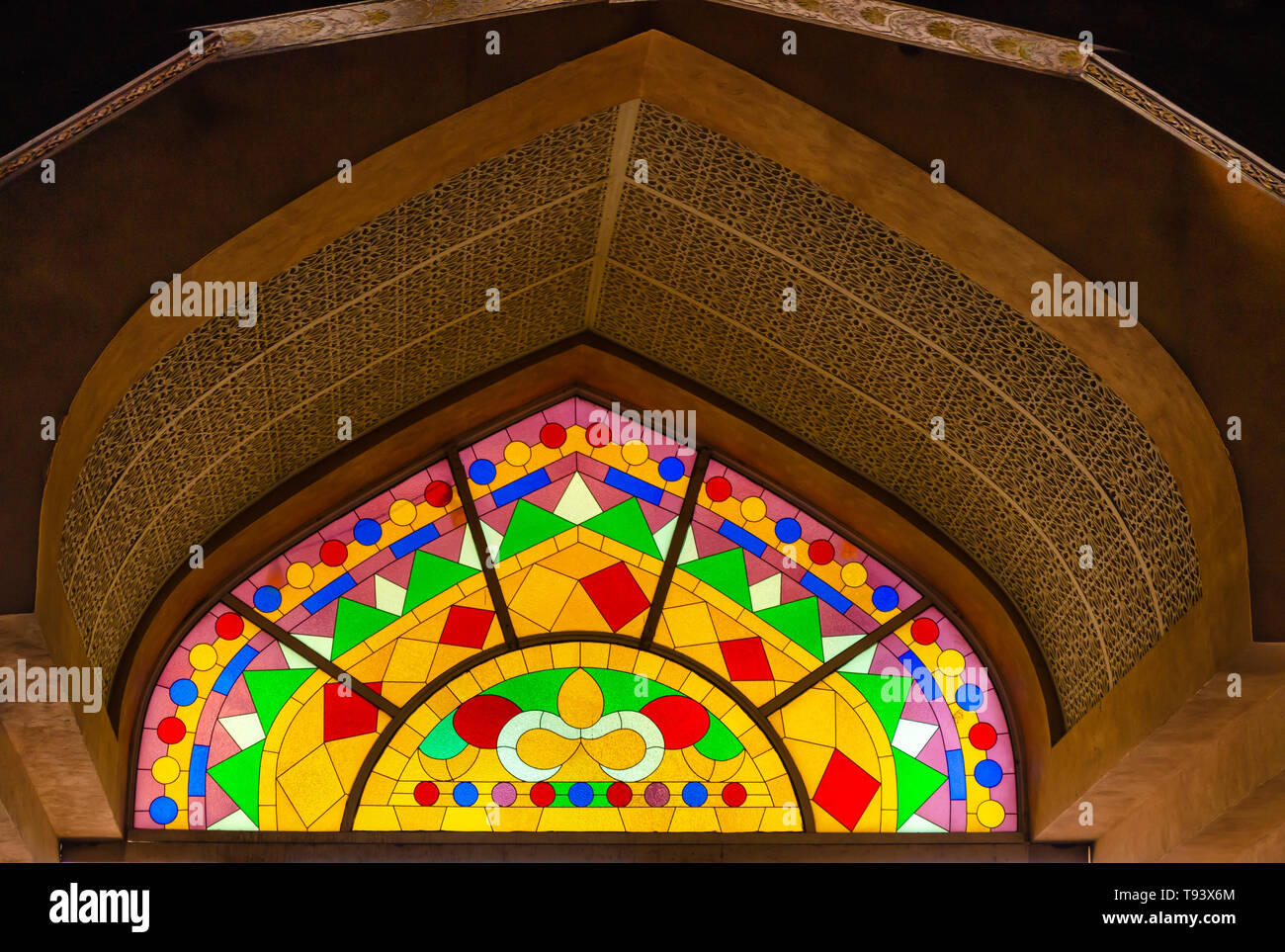 Traditional Middle Eastern style stained glass art on a huge arch. From Muscat, Oman. Stock Photo