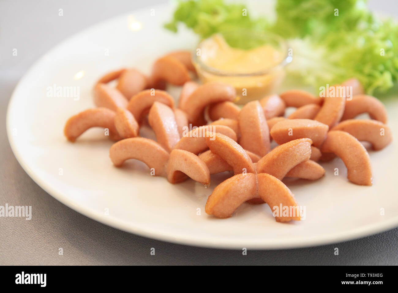 Fried cocktail sausages Stock Photo
