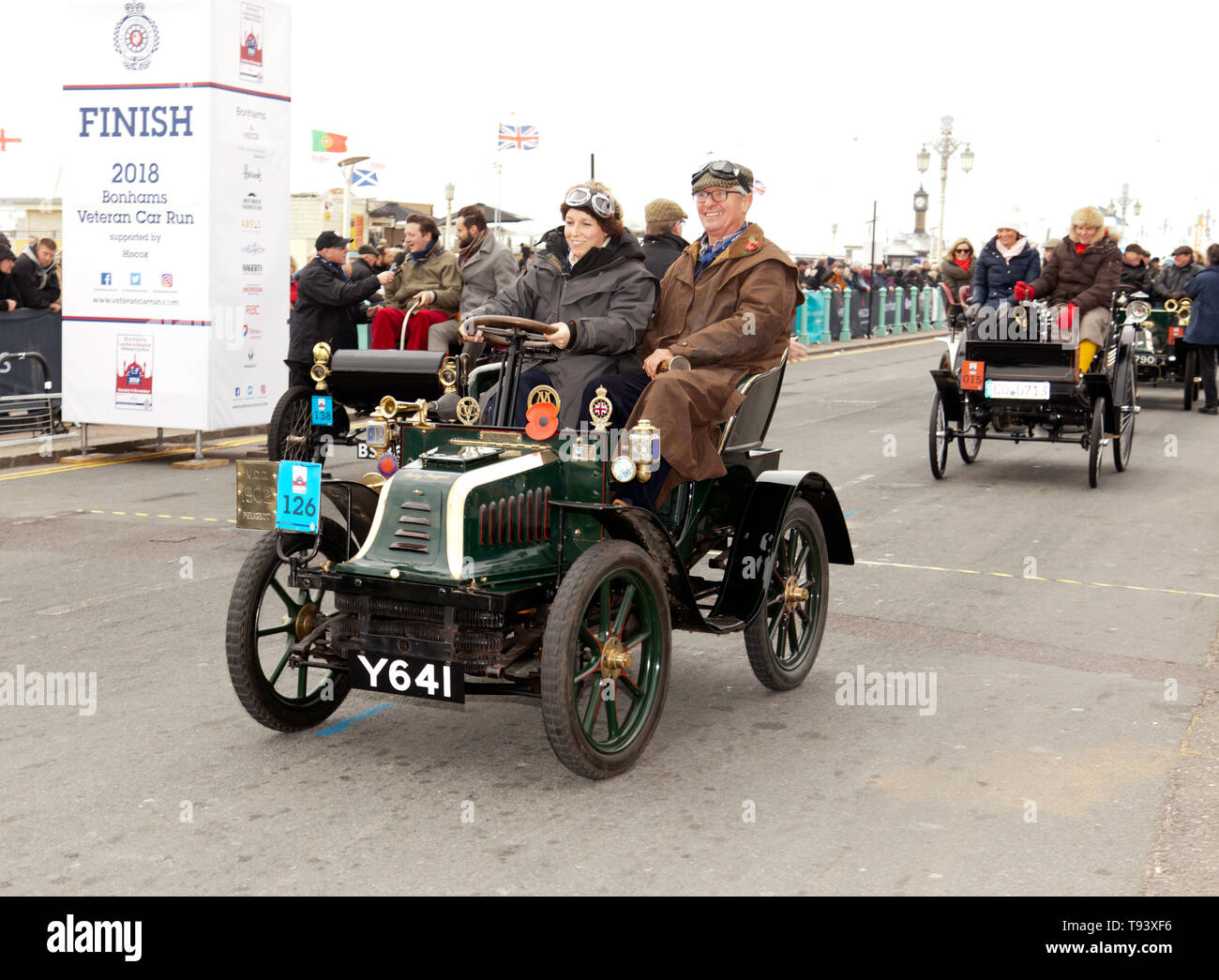 Lydia Farley driving a 1902, Peugeot, over the finish line, of the 2018 London to Brighton Veteran Car Run Stock Photo