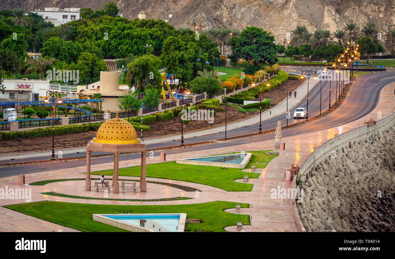 Well built seaside walk in Muttrah, Muscat, Oman with a Golden Gazebo Dome. With golden sunlight at dawn. Stock Photo