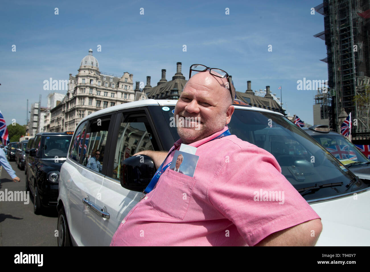 Parliament Square, Westminster, London. May 16th 2019. Striking taxi driver with a photo of Nigel Farage in his pocket. Stock Photo