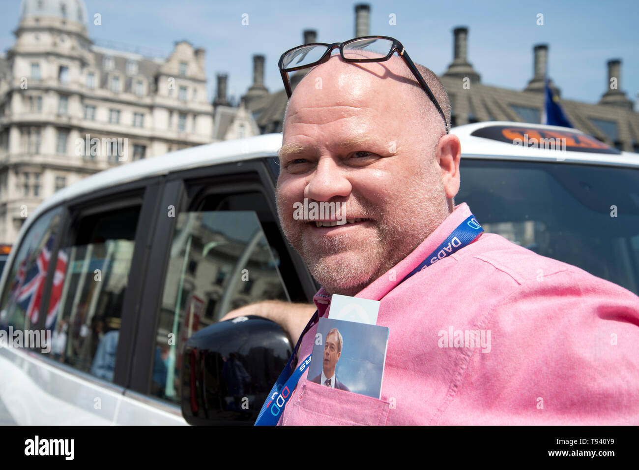 Parliament Square, Westminster, London. May 16th 2019. Striking taxi driver with a photo of Nigel Farage in his pocket. Stock Photo