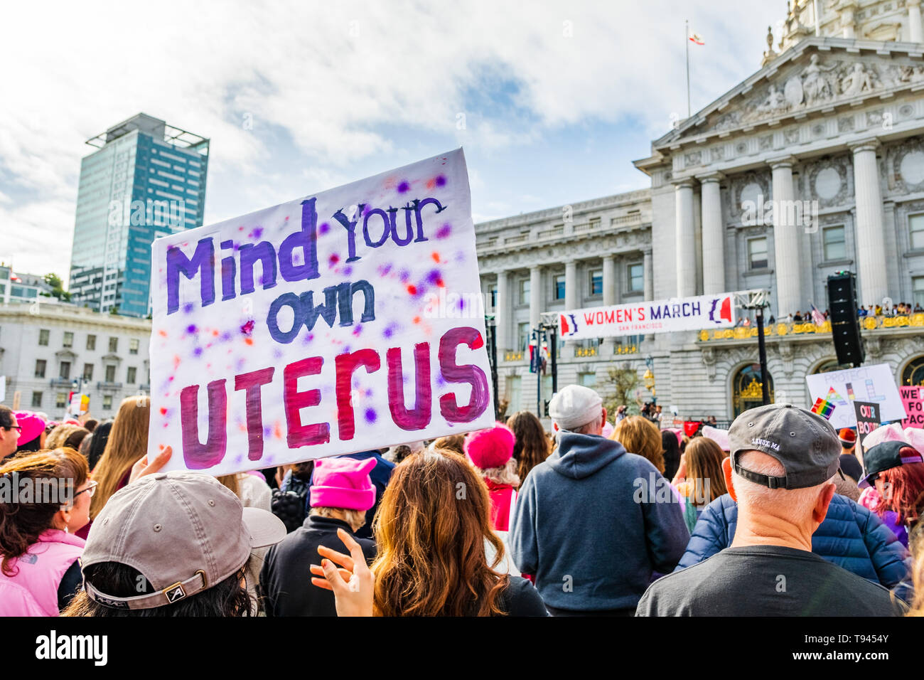 January 19, 2019 San Francisco / CA / USA - Participant to the Women's March event holds 'Mind your own uterus' sign at the rally held in front of the Stock Photo