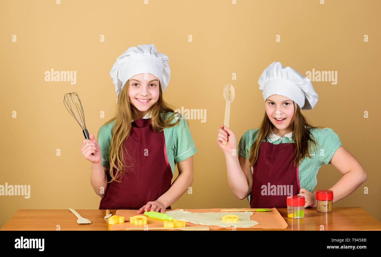 Family recipe. Cooking skill culinary education. Baking ginger cookies. Girls sisters having fun