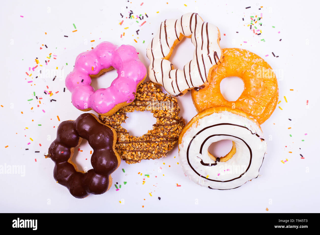 Colorful Donuts on white background Stock Photo - Alamy