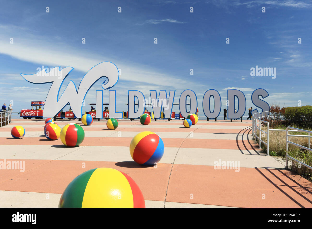 The Wildwoods Sign welcoming travelers to the resort cities of Wildwood, Wildwood Crest and North Wildwood, New Jersey, USA.The Tram Car in behind Stock Photo
