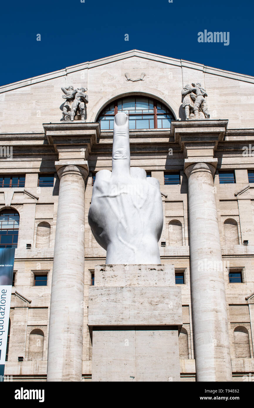 Milan, Italy: L.O.V.E. or The Finger, sculpture made by Maurizio Cattelan  in front of Palazzo Mezzanotte, building housing is the Milan Stock  Exchange Stock Photo - Alamy