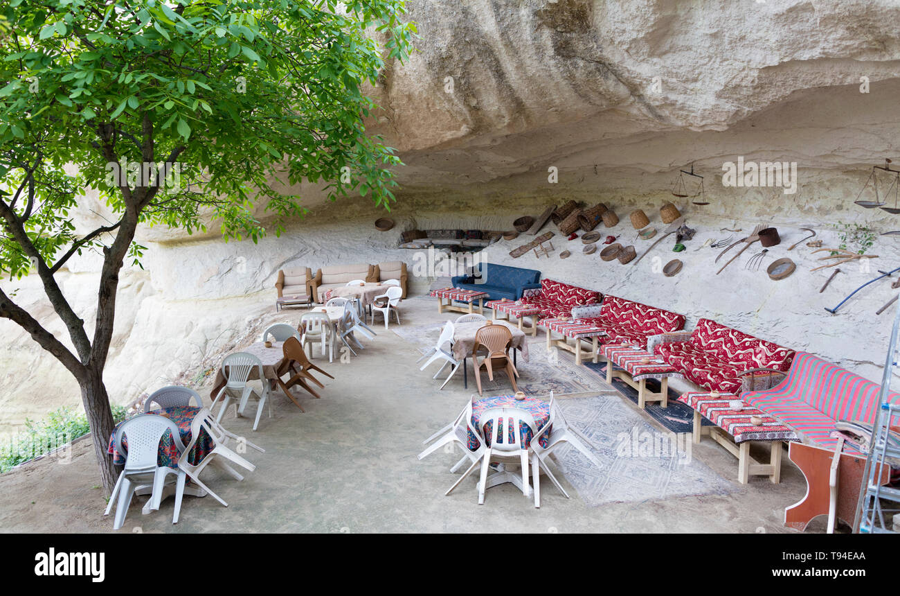 A welcoming view of an old cafe in a high-rise Turkish courtyard in Cappadocia Stock Photo