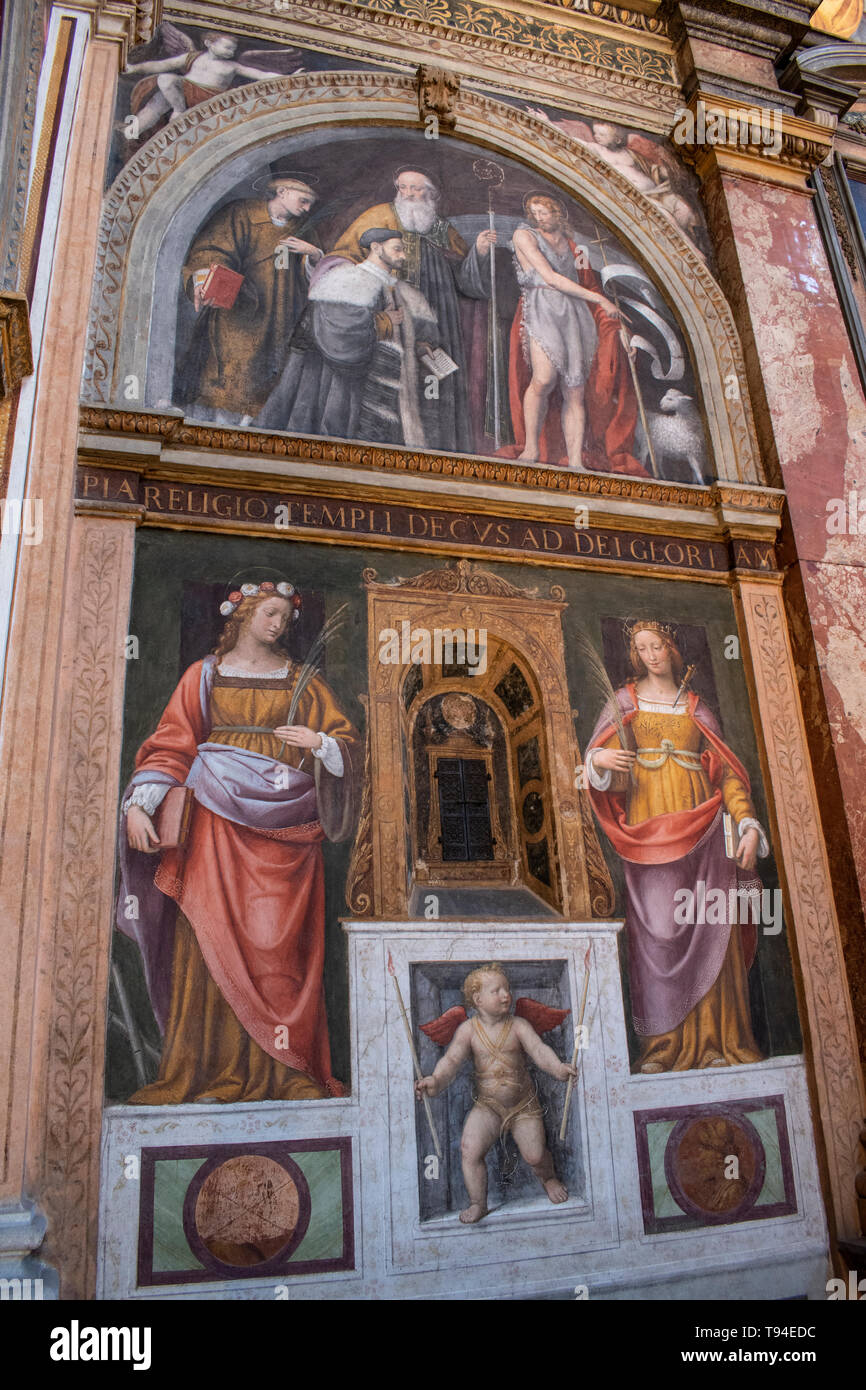 Italy: inside San Maurizio al Monastero Maggiore, a church known as the Sistine Chapel of Milan, altarpiece and partition wall in the faithful's area Stock Photo
