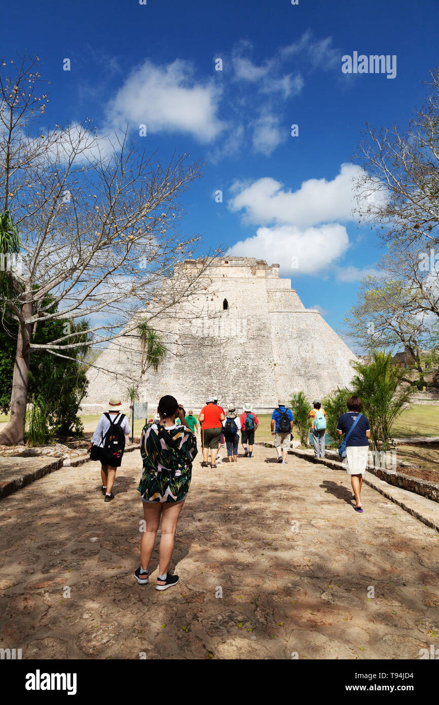 Latin America travel - people photographing the Pyramid of the Magician aka the Pyramid of the Dwarf, Uxmal mayan ruins, Uxmal, Mexico Latin America Stock Photo