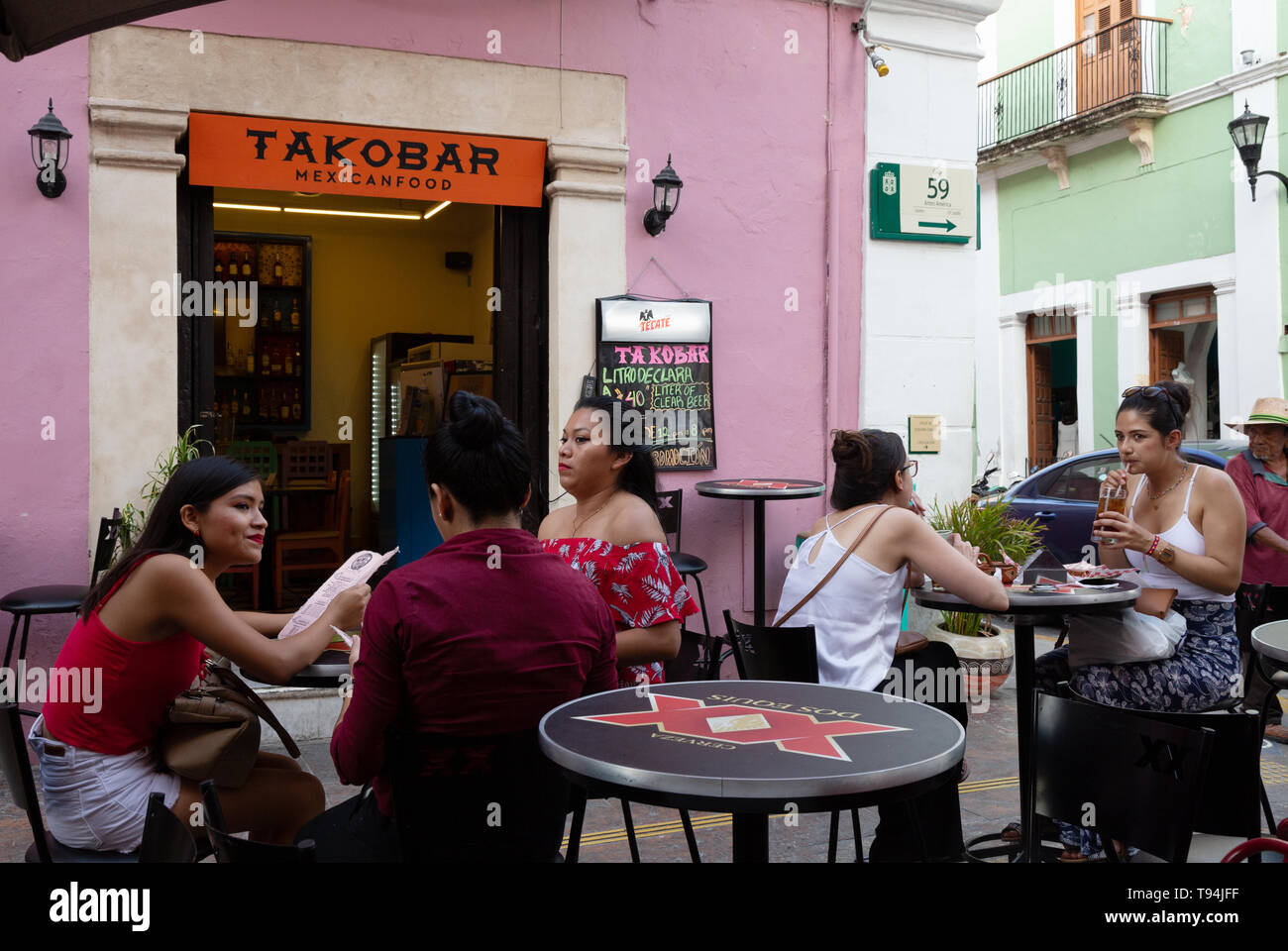 Latin America food - people eating at a taco bar cafe outside, Campeche old town UNESCO world heritage site, Campeche Mexico, Latin America Stock Photo