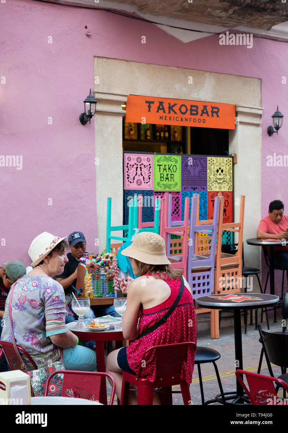 Latin America food - people eating at a taco bar cafe outside, Campeche old town UNESCO world heritage site, Campeche Mexico, Latin America Stock Photo