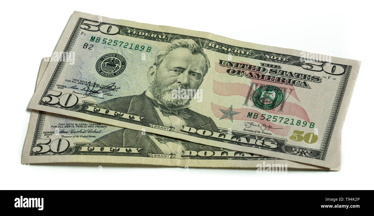 Two US currency fifty dollar bills featuring the 18th U.S. President, Ulysses S. Grant isolated on a white background Stock Photo