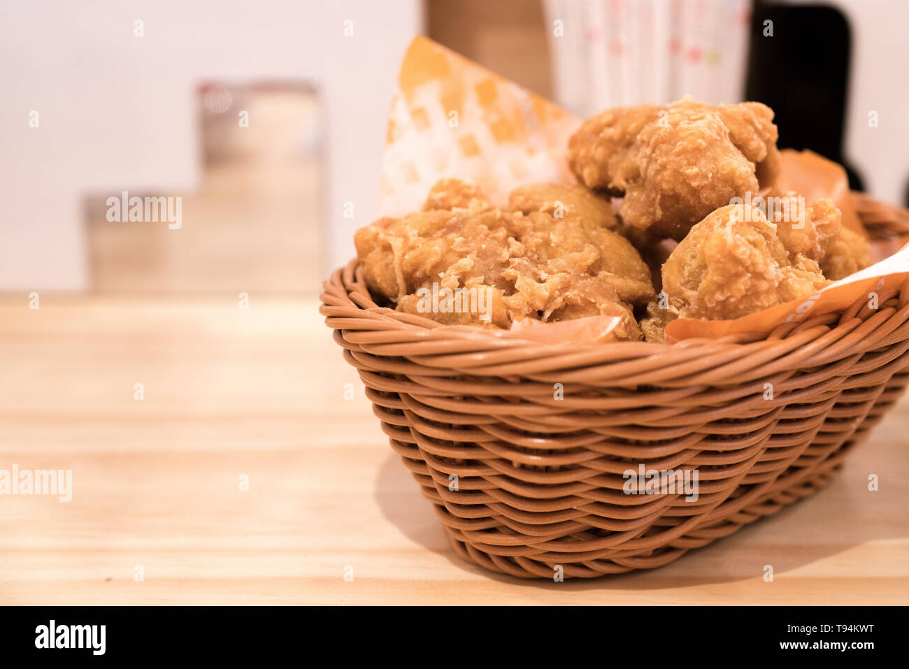 Breaded crispy fried chicken drumctick in the basket Stock Photo Alamy