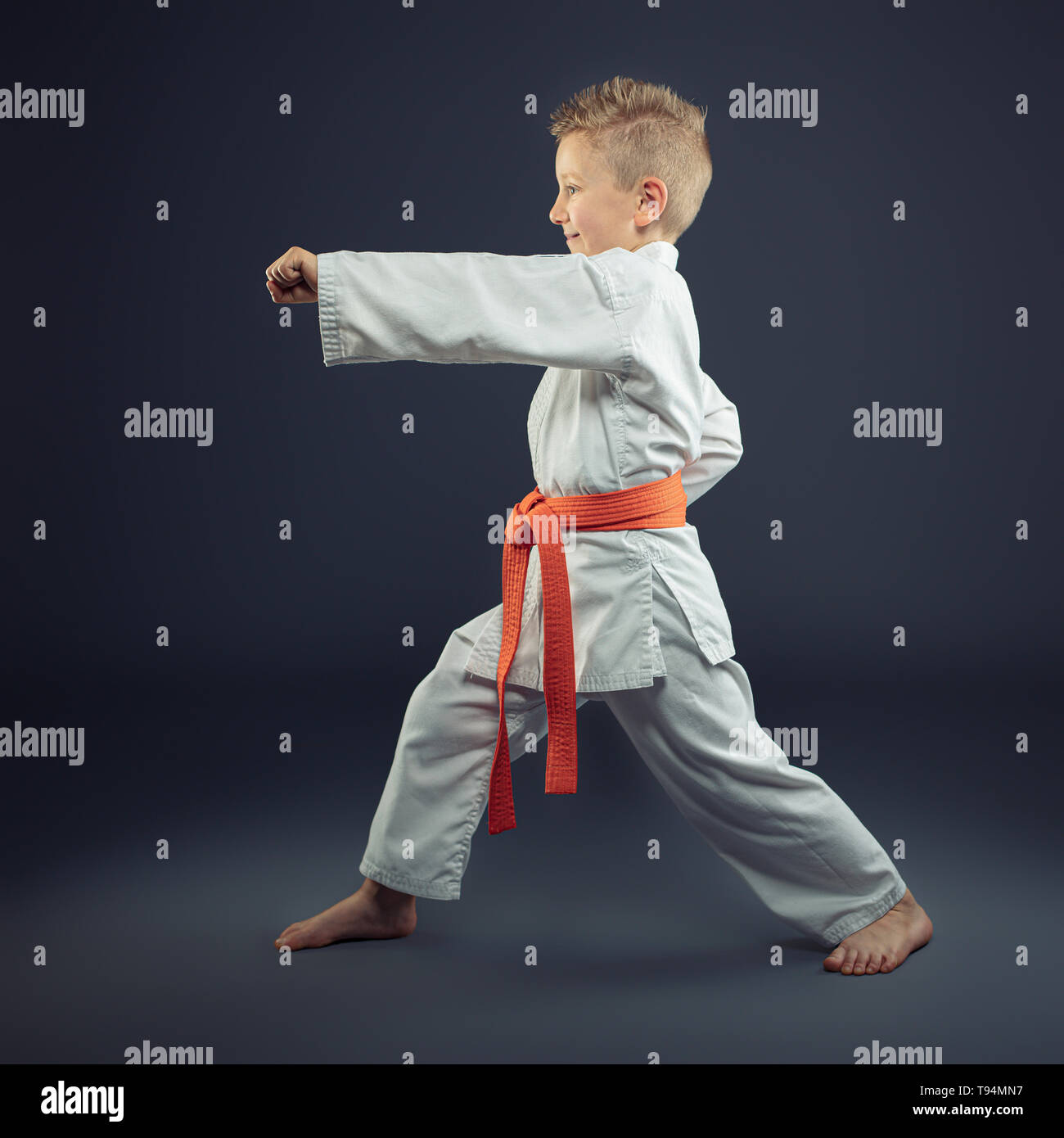 portrait of a child with a kimono practicing martial arts Stock Photo