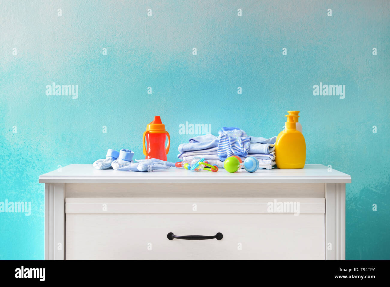 Baby clothes and accessories on dresser Stock Photo Alamy