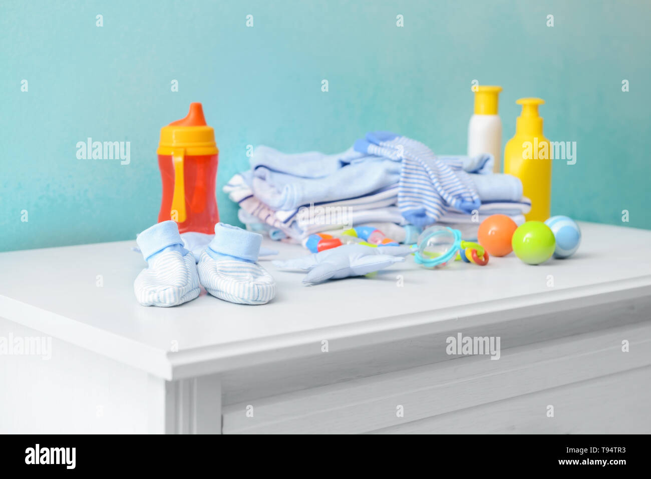 Baby clothes and accessories on dresser Stock Photo Alamy