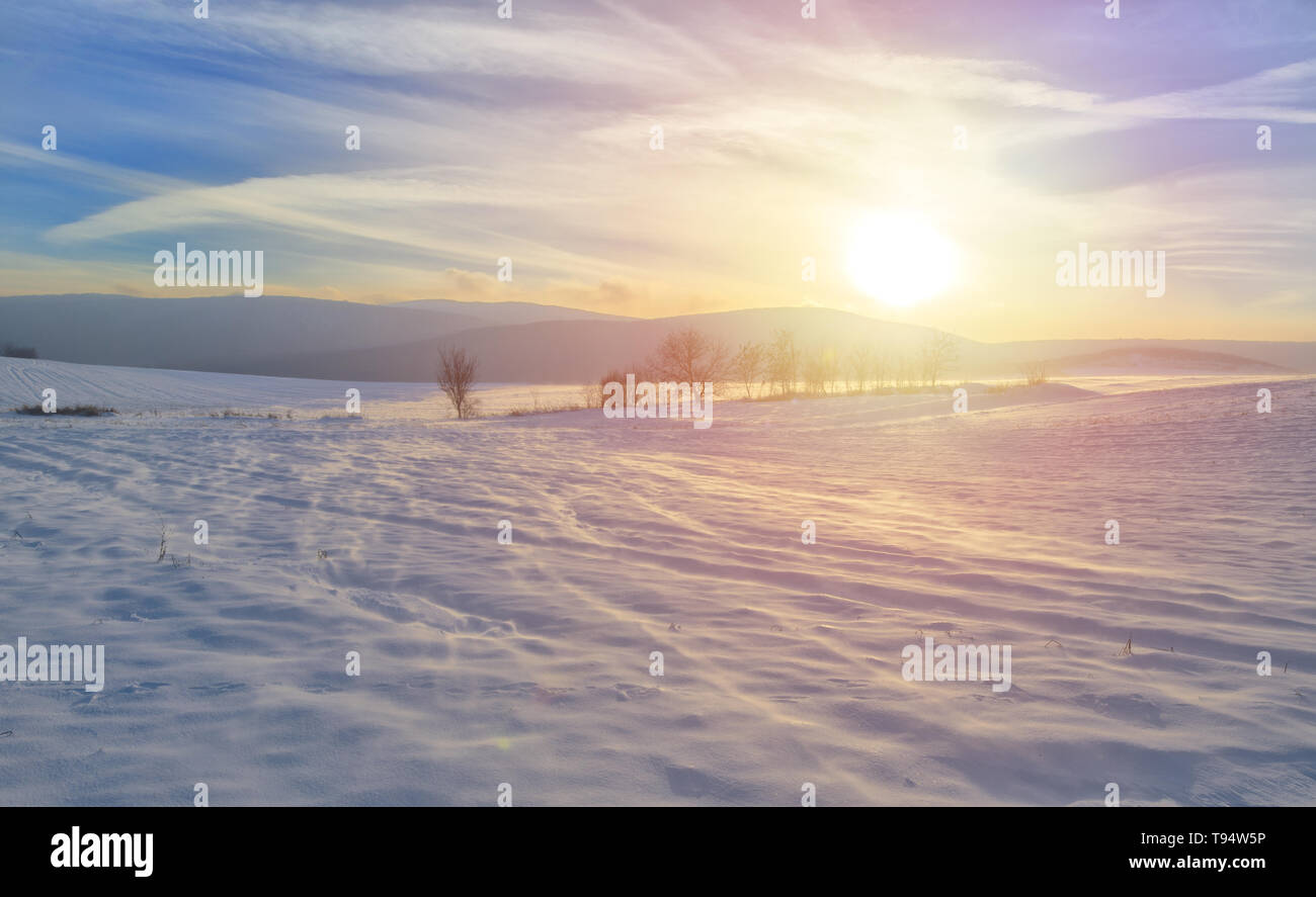 Sunrise over snow covered field landscape hi-res stock photography and ...