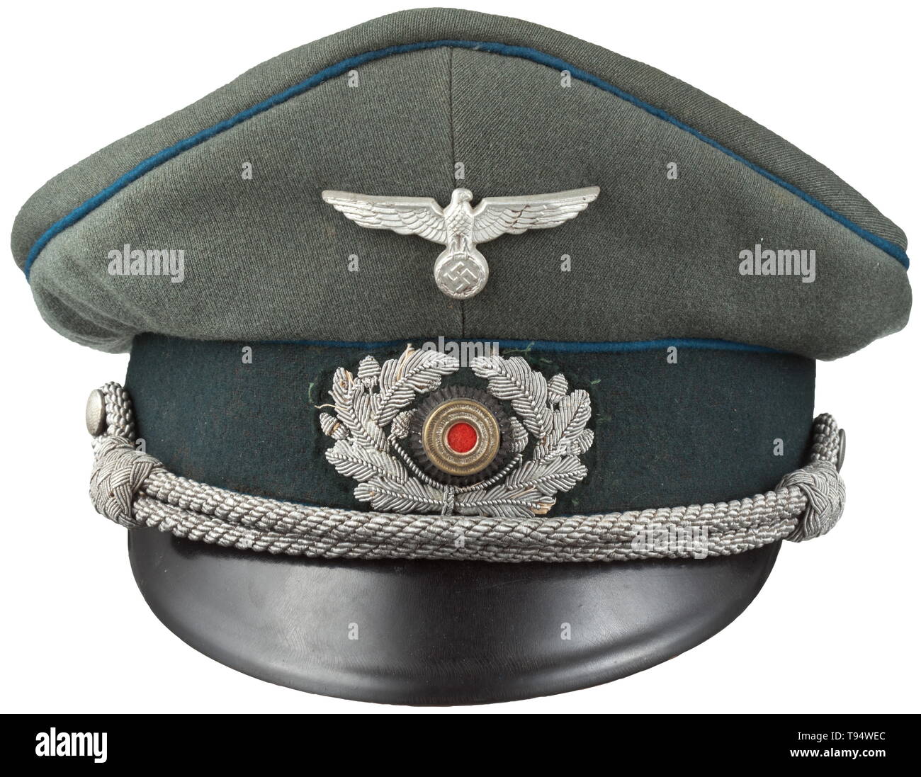 A visor cap for officers of the administrative and judicial special service maker August Müller, Munich Private purchase piece of field-grey gabardine, dark green trim band, light blue piping (slight mothing), beige inner liner, beneath the cap trapezoid a maker's tag 'A.Müller München...', dark grey sweatband of replacement material, aluminium eagle, hand embroidered cap wreath with metal cockade, officer's cord. A lightly used cap with signs of age. historic, historical, army, armies, armed forces, military, militaria, object, objects, stills, clipping, clippings, cut out, Editorial-Use-Only Stock Photo