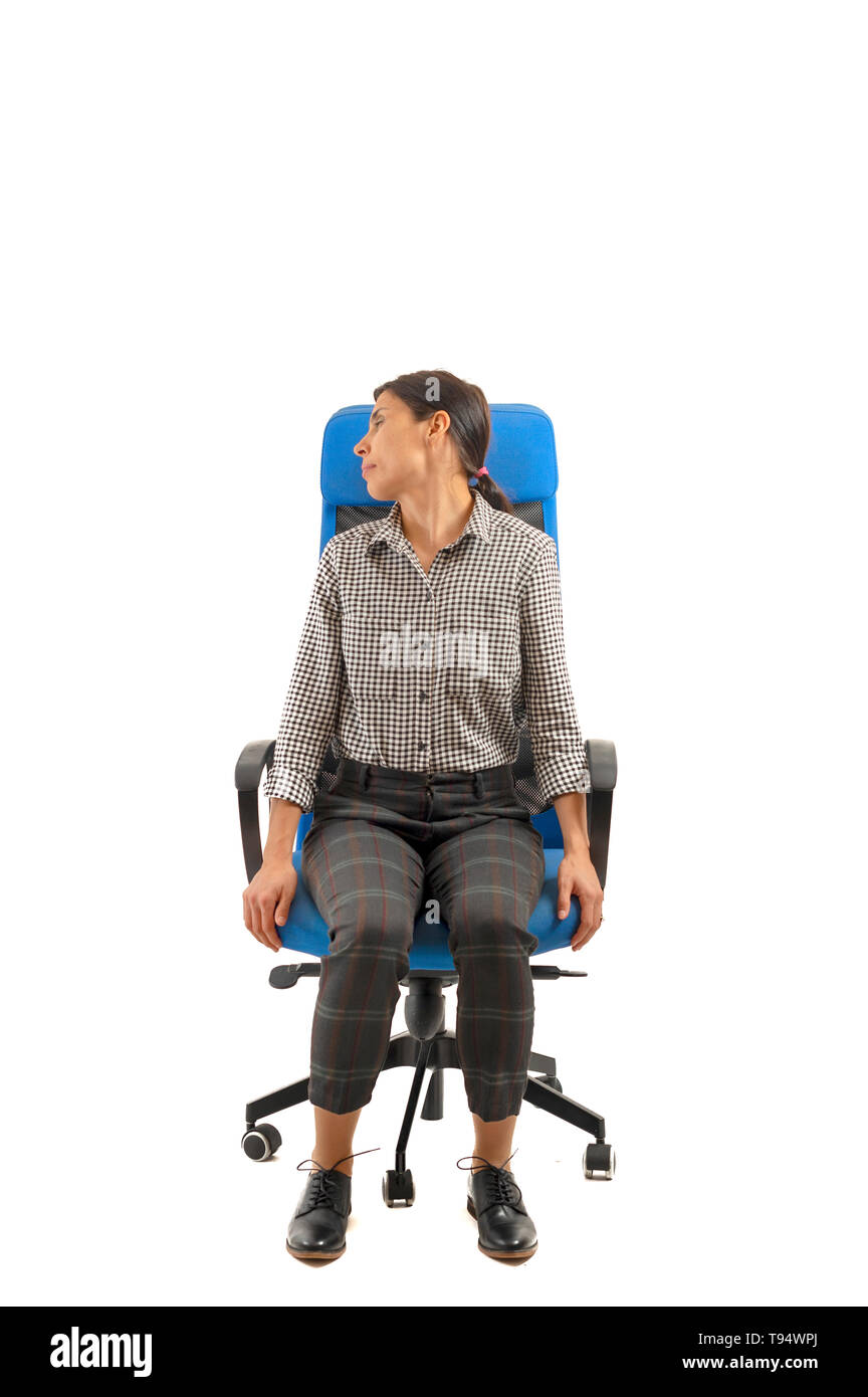 Woman doing exercises while sitting on the office chair, isolated on white Stock Photo