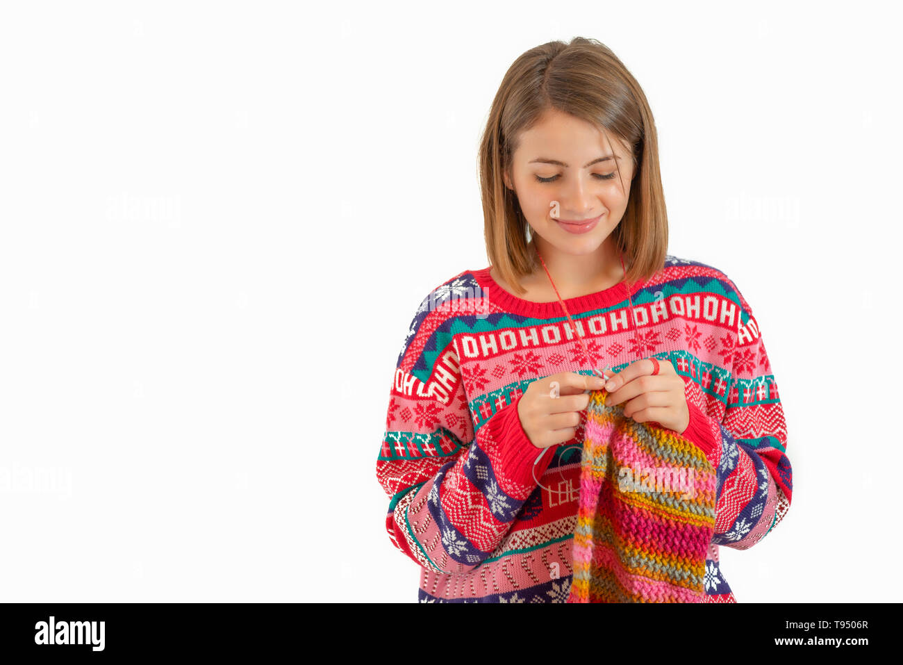Young woman knitting isolated on white background Stock Photo - Alamy