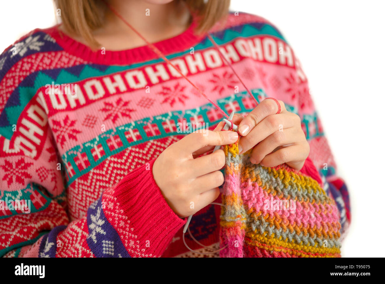 Young woman knitting isolated on white background Stock Photo - Alamy