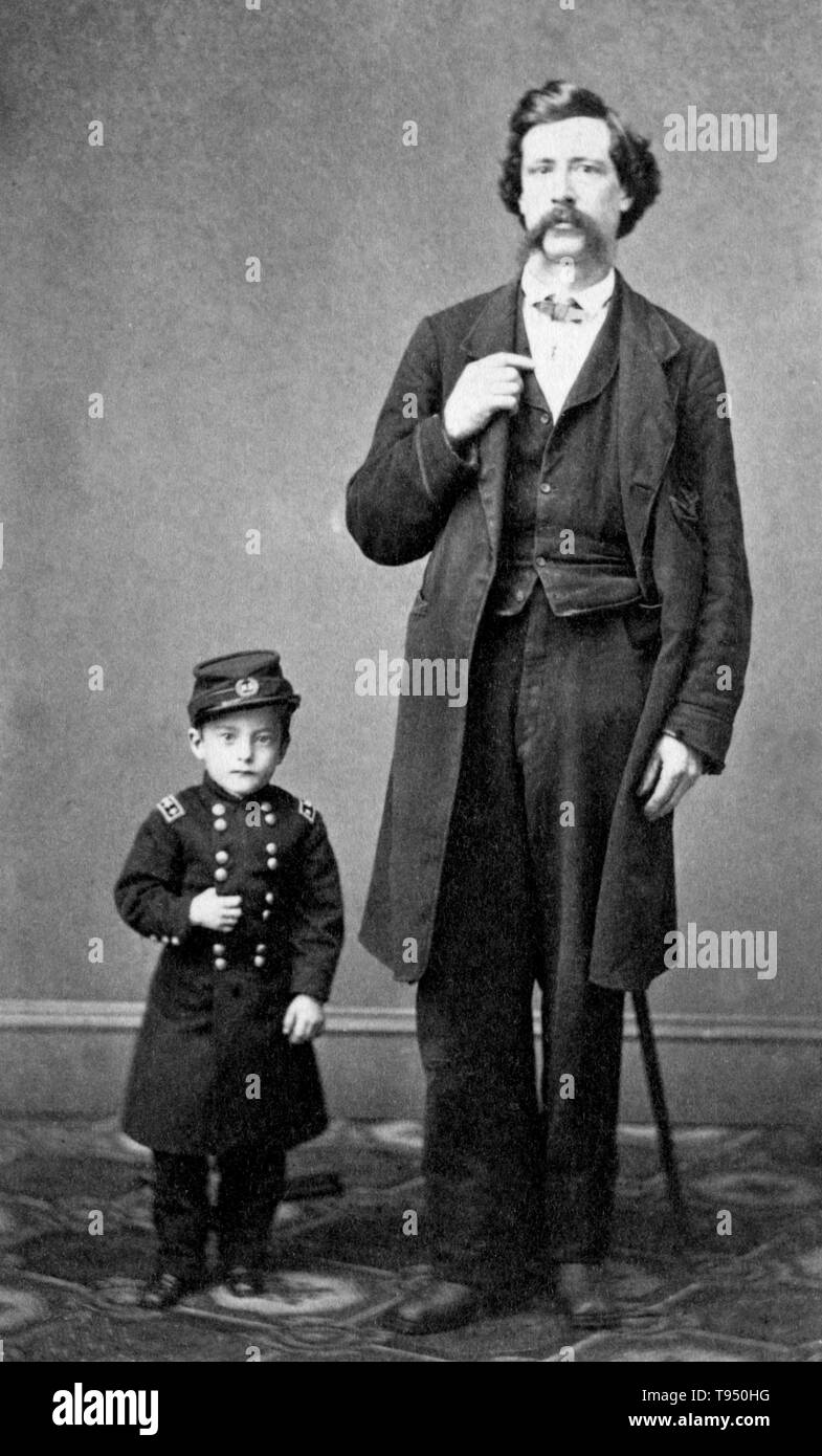 Entitled: 'General Grant, Jr. The smallest man living, 13 years old, 23 inches high, and weighs 18 1/2 pounds, as he appeared at Barnum's Museum, New York' standing next to an unidentified man. Edmund Newell (July 27, 1857 - December 23, 1915), better known as General Grant Jr. or Major Edward Newell, was a 19th century dwarf from Chicago who gained fame as an associate of P. T. Barnum. Edmund married Minnie Warren in 1877. Stock Photo