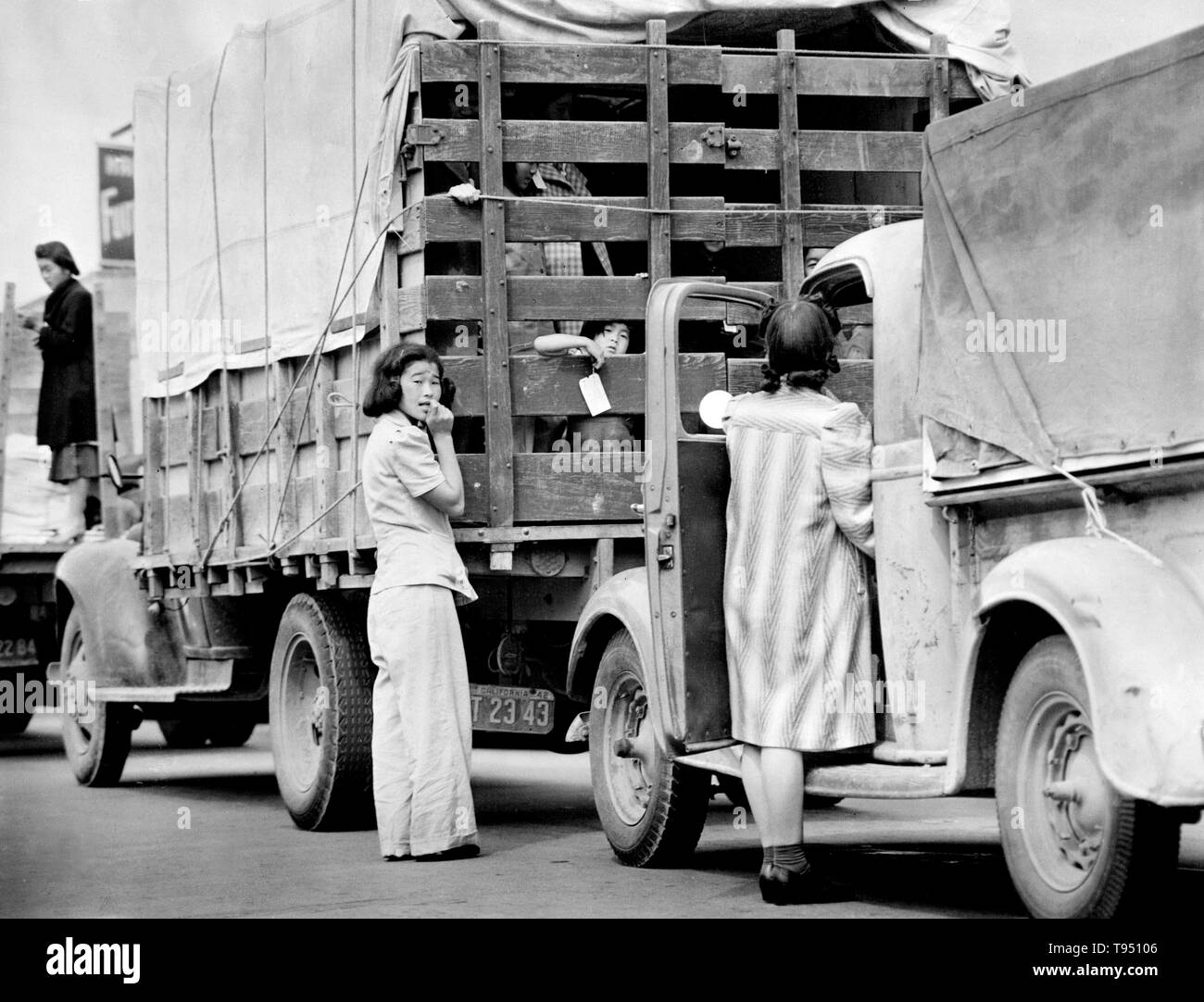 Entitled: 'The last Redondo Beach residents of Japanese ancestry leaving by truck for relocation.' The internment of Japanese-Americans during WWII was the forced relocation and incarceration in camps of 110,000-120,000 people of Japanese ancestry (62% of the internees were US citizens) ordered by President Roosevelt shortly after Japan's attack on Pearl Harbor. Japanese-Americans were incarcerated based on local population concentrations and regional politics. Stock Photo