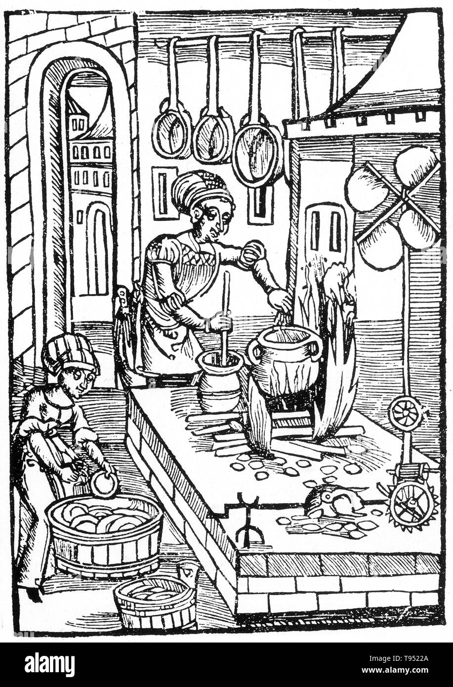 In most medieval households, cooking was done on an open hearth in the middle of the main living area, to make efficient use of the heat. This was the most common arrangement, even in wealthy households, where the kitchen was combined with the dining hall. Towards the Late Middle Ages a separate kitchen area began to evolve. Stock Photo