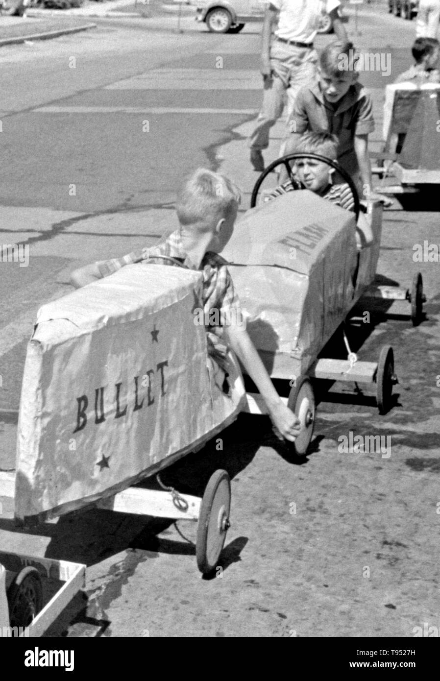 Entitled: 'Entrants in soapbox auto race during July 4th celebration at Salisbury, Maryland.' The Soap Box is a youth soapbox car racing program which has been run in the United States since 1934. World Championship finals are held each July at Derby Downs in Akron, Ohio. Cars competing in this and related events are unpowered, relying completely upon gravity to move. Stock Photo