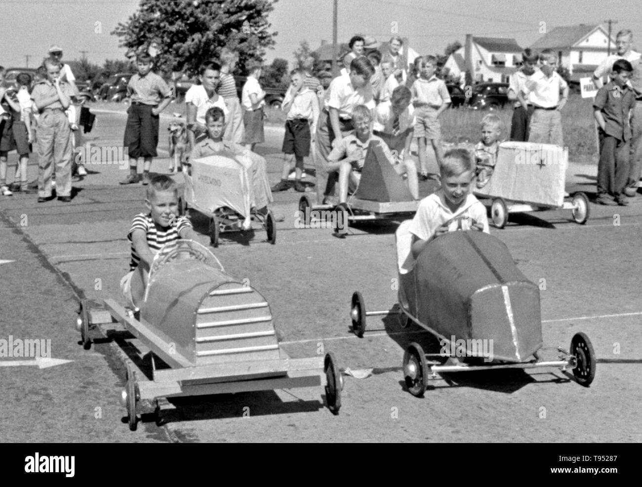 Entitled: 'The winners of the soapbox auto race during July 4th celebration at Salisbury, Maryland.' The Soap Box is a youth soapbox car racing program which has been run in the United States since 1934. World Championship finals are held each July at Derby Downs in Akron, Ohio. Cars competing in this and related events are unpowered, relying completely upon gravity to move. Stock Photo