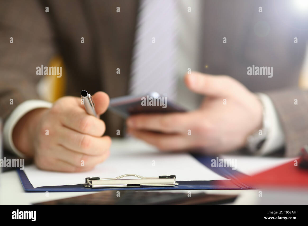 Male Arm In Suit Hold Phone And Silver Pen At Workplace Closeup Read News Mania Send Sms Chat Addict Use Electronic Bank Modern Lifestyle Job Plan Co Stock Photo Alamy