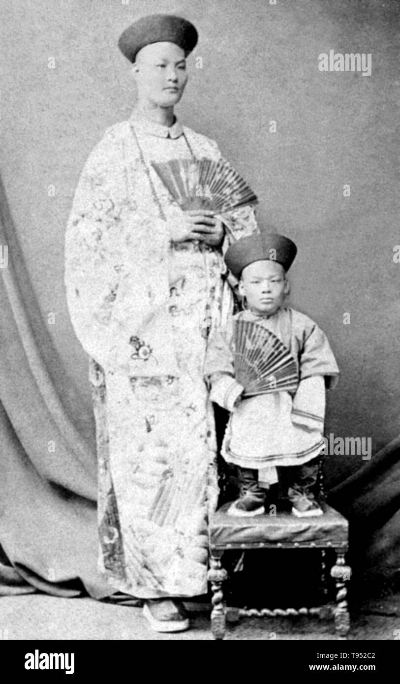 Chang Yu-sing the Chinese giant, and Chung Mow, a dwarf. Zhan Shichai AKA Chang Woo Gow (1841/47 - November 5, 1893) was a Chinese giant. His height was claimed to be over 8 feet, but there are no authoritative records. He left China in 1865 to travel to London where he appeared on stage, later travelling around Europe, and to the US and Australia as 'Chang the Chinese Giant'. Zhan received a good education in various countries, and developed a good understanding of ten languages. Stock Photo