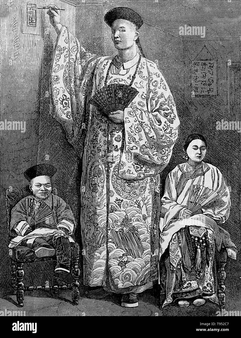 Chang Yu-sing the Chinese giant, with his wife, King-Foo and Chung Mow, a dwarf. Zhan Shichai AKA Chang Woo Gow (1841/47 - November 5, 1893) was a Chinese giant. His height was claimed to be over 8 feet, but there are no authoritative records. He left China in 1865 to travel to London where he appeared on stage, later travelling around Europe, and to the US and Australia as 'Chang the Chinese Giant'. Stock Photo