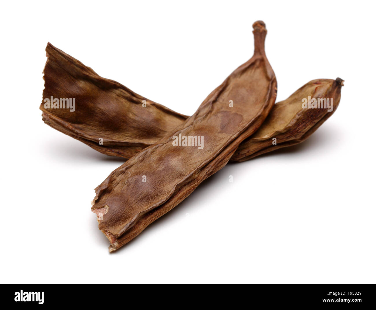 Ripe carob pods isolated on white background Stock Photo Alamy