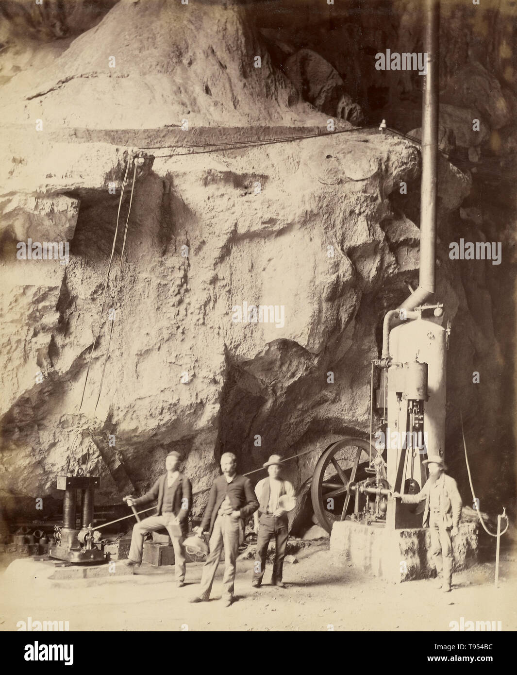 Engine and dynamo-electric machine used in lighting the Jenolan Caves. Charles Smith Wilkinson (Australian, born England, 1843 - 1891); New South Wales, Australia; about 1885 - 1890; Collodion print. The Jenolan Caves are limestone caves located within the Jenolan Karst Conservation Reserve in the Central Tablelands region, west of the Blue Mountains, in New South Wales, in eastern Australia. Stock Photo