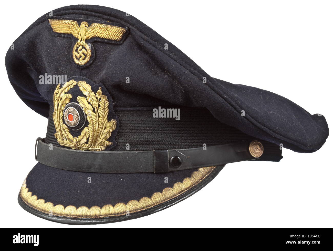 A visor cap for subaltern officers in the Kriegsmarine Navy-blue cloth,  trim band of black mohair, beige silk liner, beneath the cap trapezoid the  silver imprinted maker "Die Nordmann Mütze bürgt für