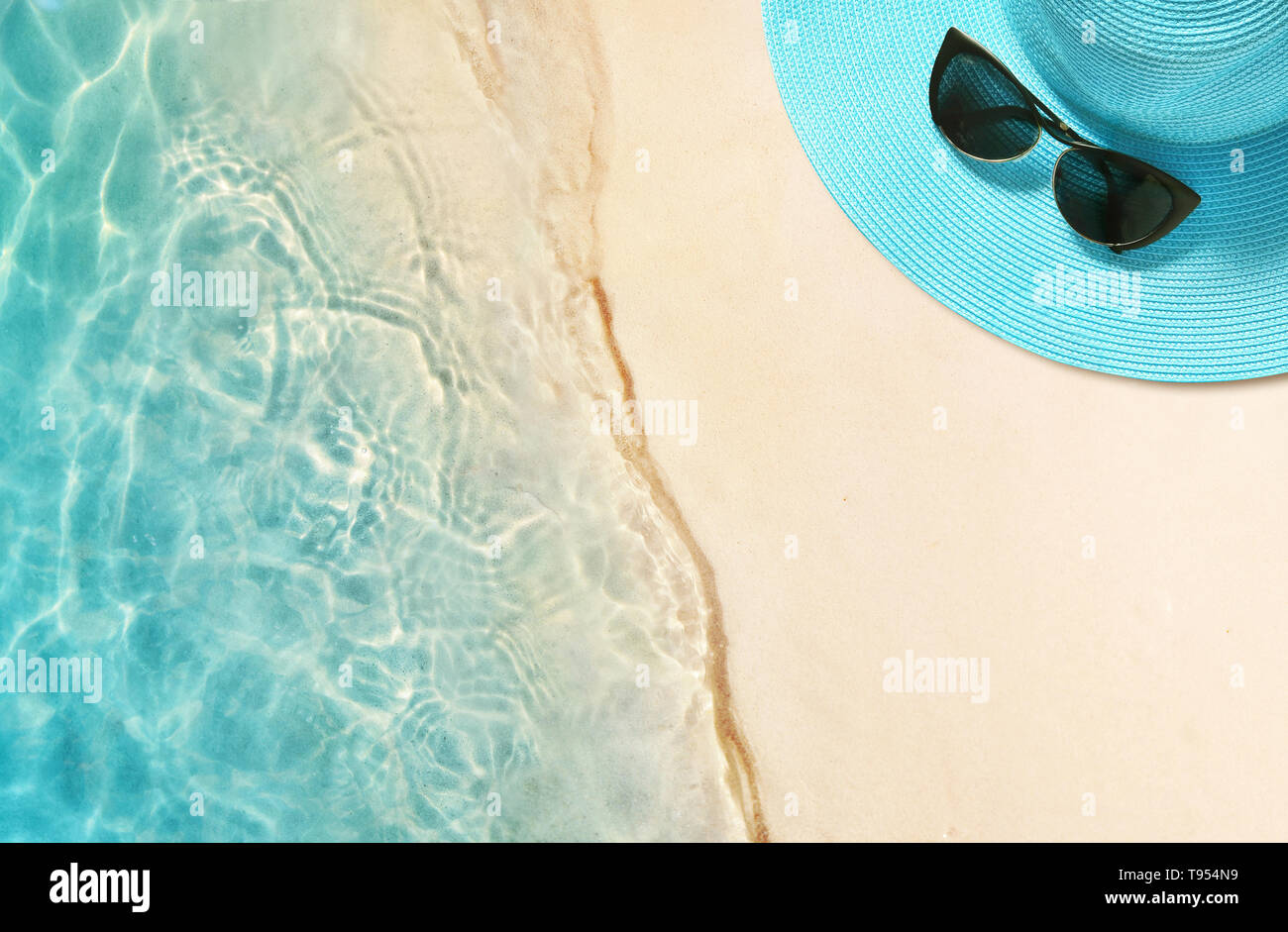 Hat and sunglasses on the sandy beach. Summer background Stock Photo ...