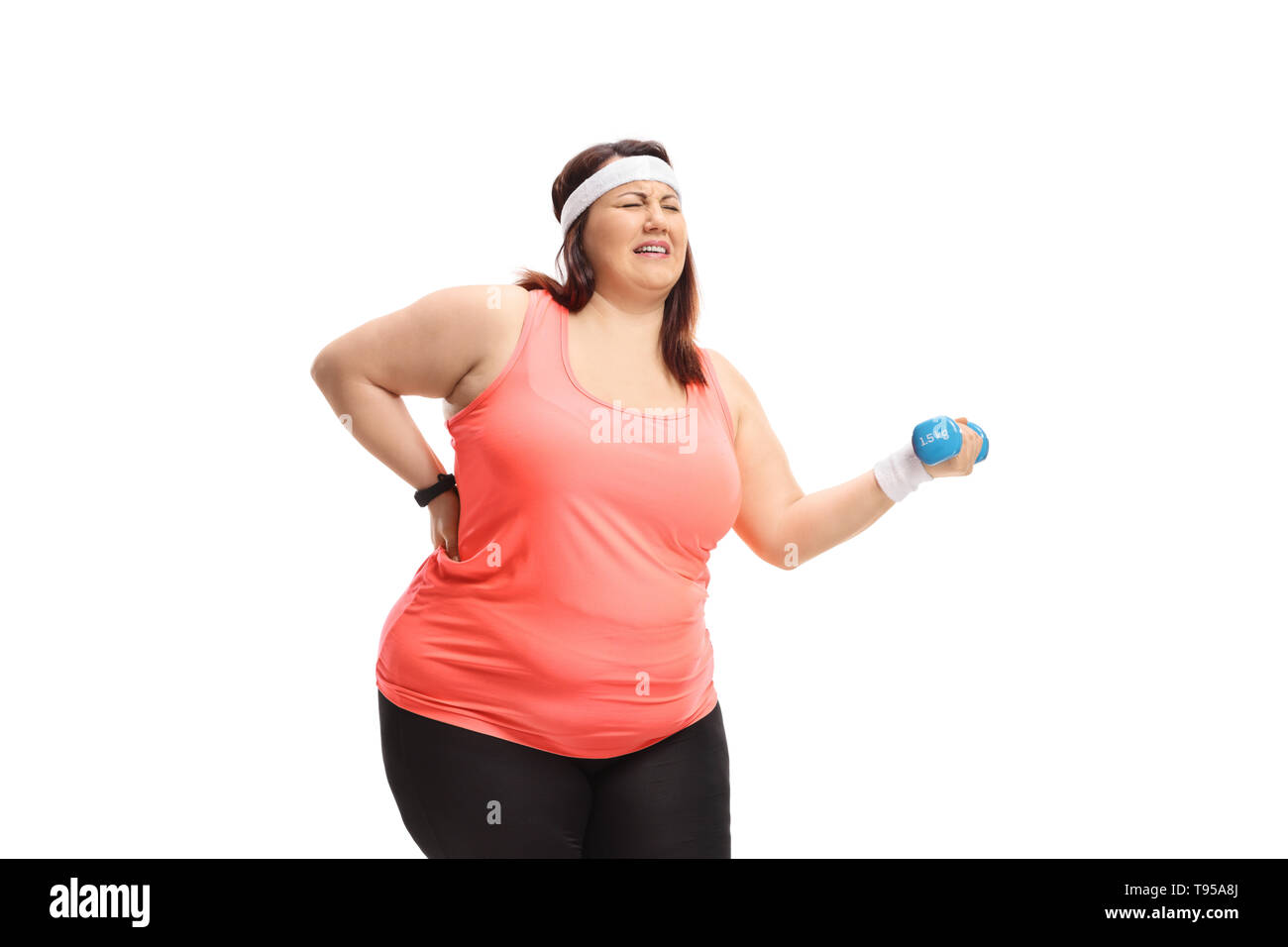 Overweight woman strugling to lift a small dumbbell isolated on white background Stock Photo