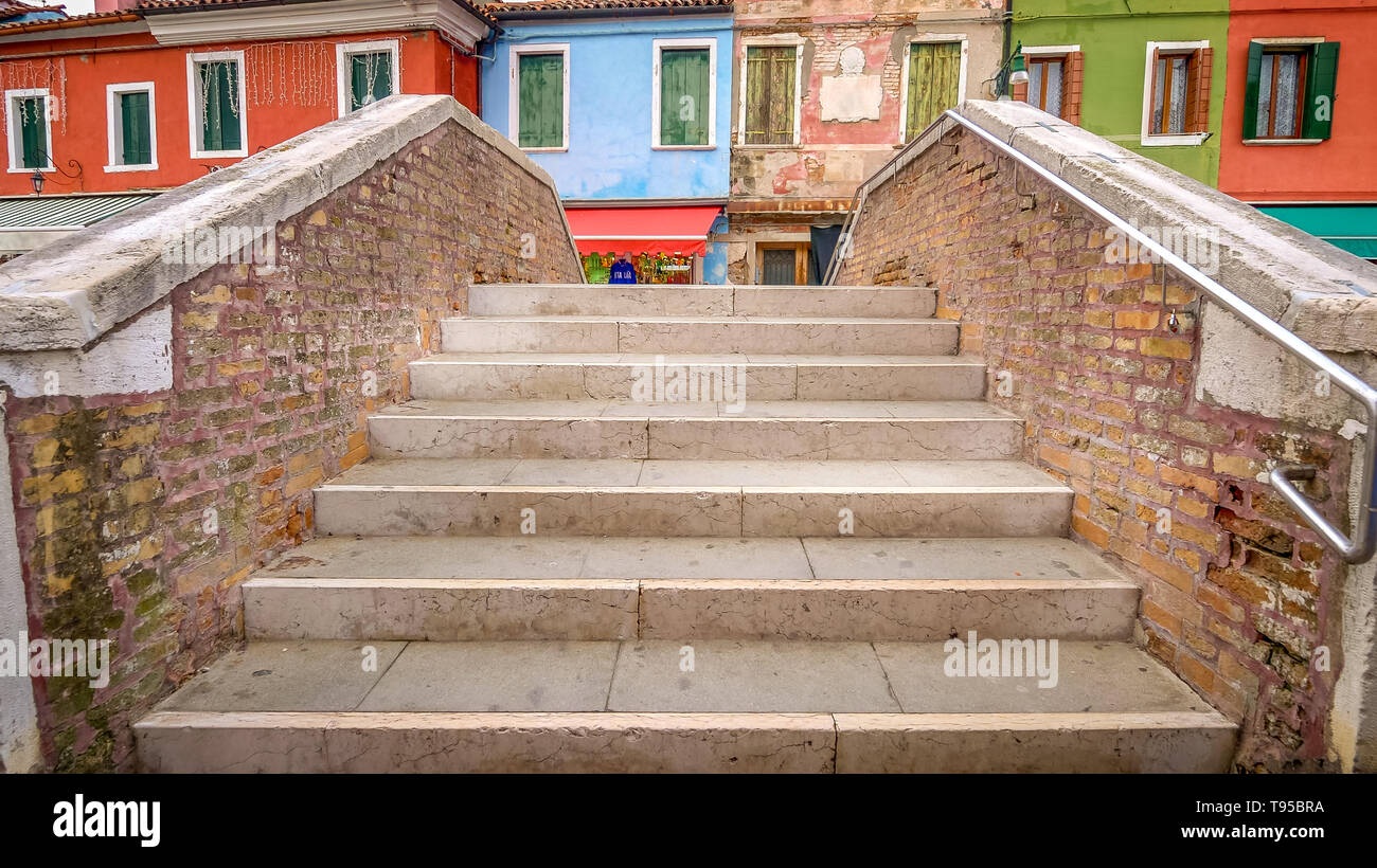 Village of Burano, Steps of Bridge Over Canal - Venice, Italy Stock Photo