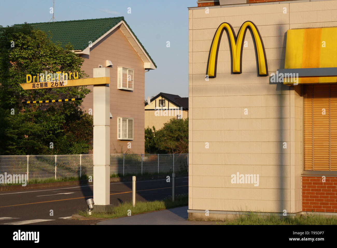 The drive-thru section of a McDonalds restaurant located at the side of a busy main road in Naruto in Sanmu City. Stock Photo