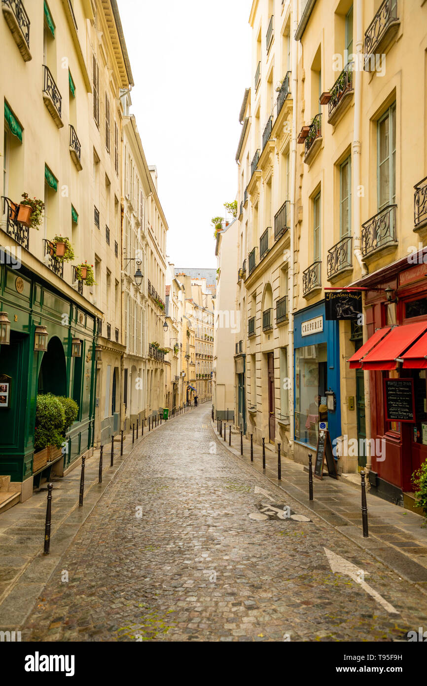 Paris, France - 24.04.2019: Old street in Paris, France. Cozy cityscape of Paris. Architecture and landmarks of Paris. Stock Photo