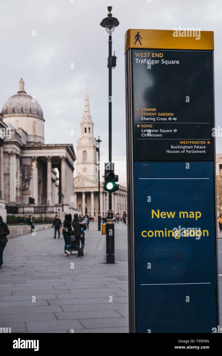 London, UK - April 14, 2019: Directions and map board in Pall Mall East, National Gallery on the background. National Gallery is a famous art museum i Stock Photo